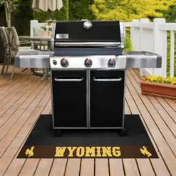 FanMats® 21637 - NCAA University Of Wyoming 26" X 42" Grill Mat With "Bucking Cowboy" Logo & "Wyoming" Wordmark -Magma Store 21637 2