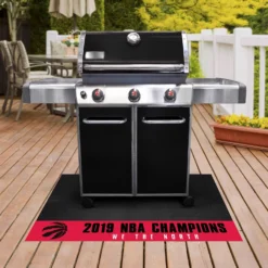 FanMats® 25323 - NBA "Toronto Raptors" 26" X 42" Grill Mat With "2019 NBA Finals Champions" Logo